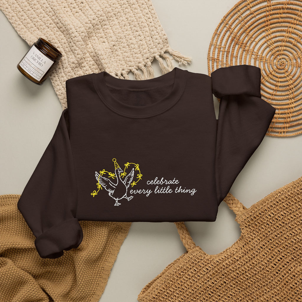 Celebrate Embroidered Goose Unisex Heavy Blend™ Crewneck Sweatshirt
